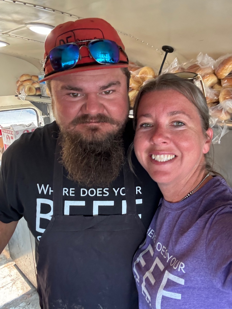 Jace and Heather Dunagan smiling inside the Burger Nation trailer in Where Does Your Beef Come From shirts